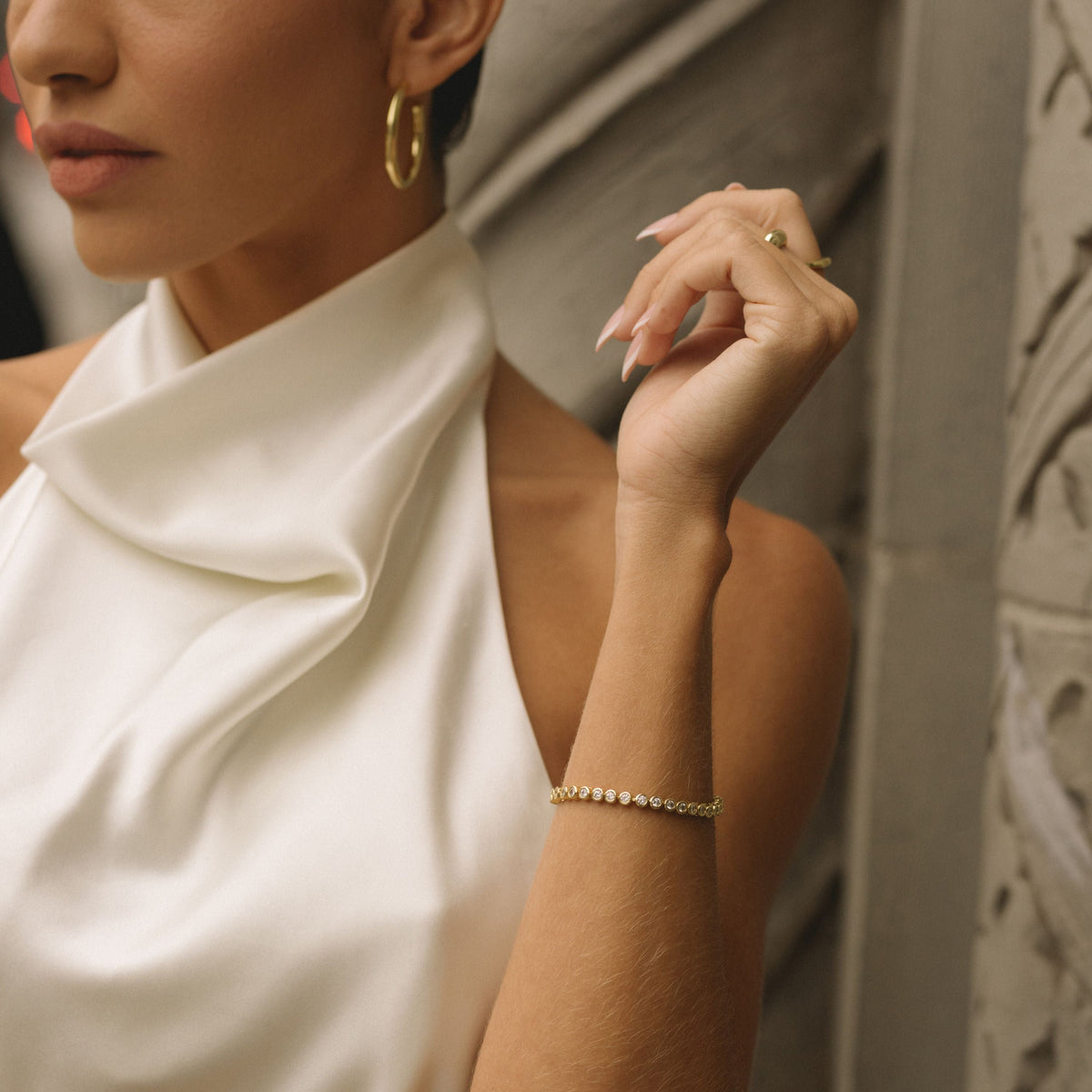Gold-filled bracelet with bezel-set diamonds on the wrist