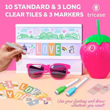 Pink light box with clear tiles and 3 markers, hand placing alphabet tile