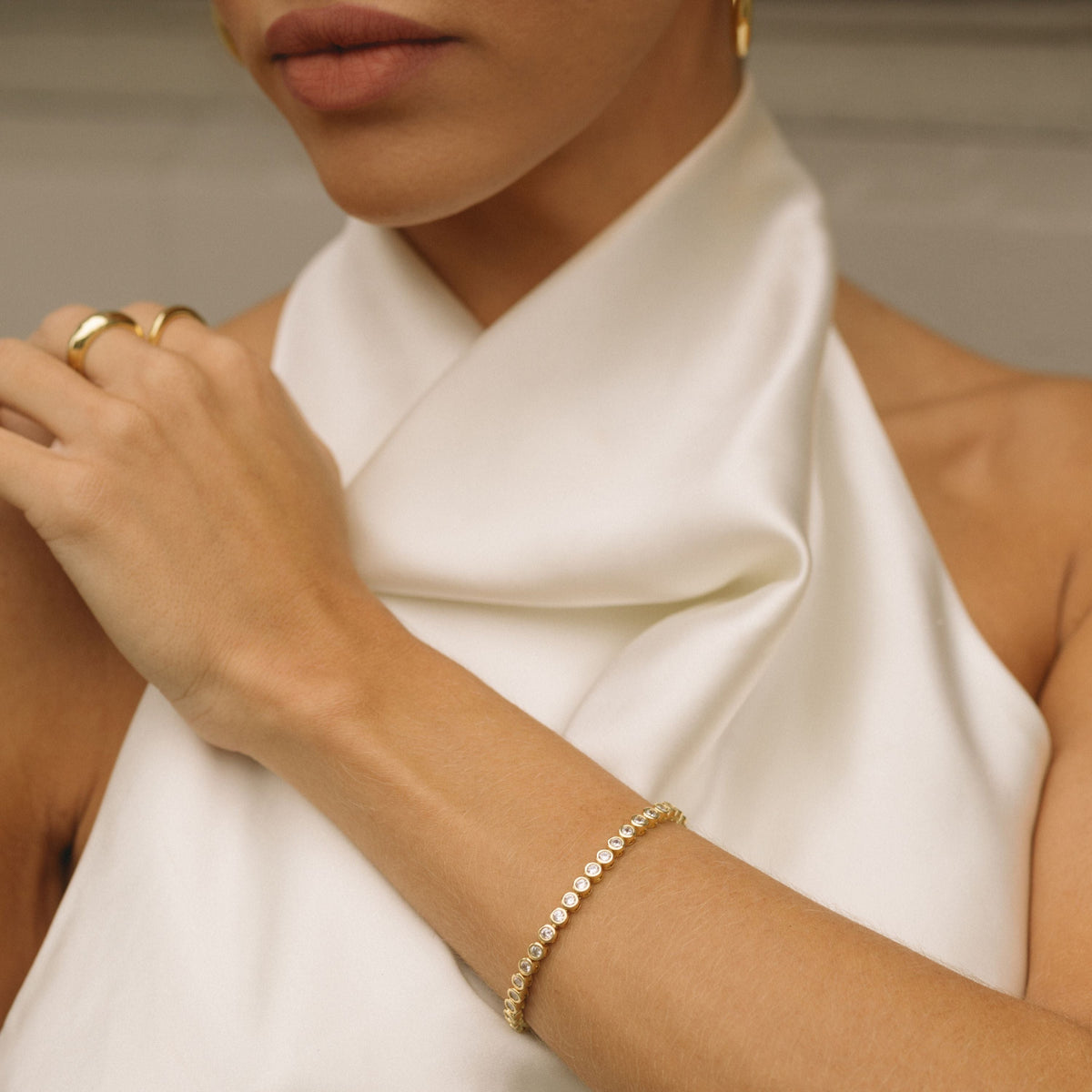 Gold filled diamond bezel bracelet on wrist