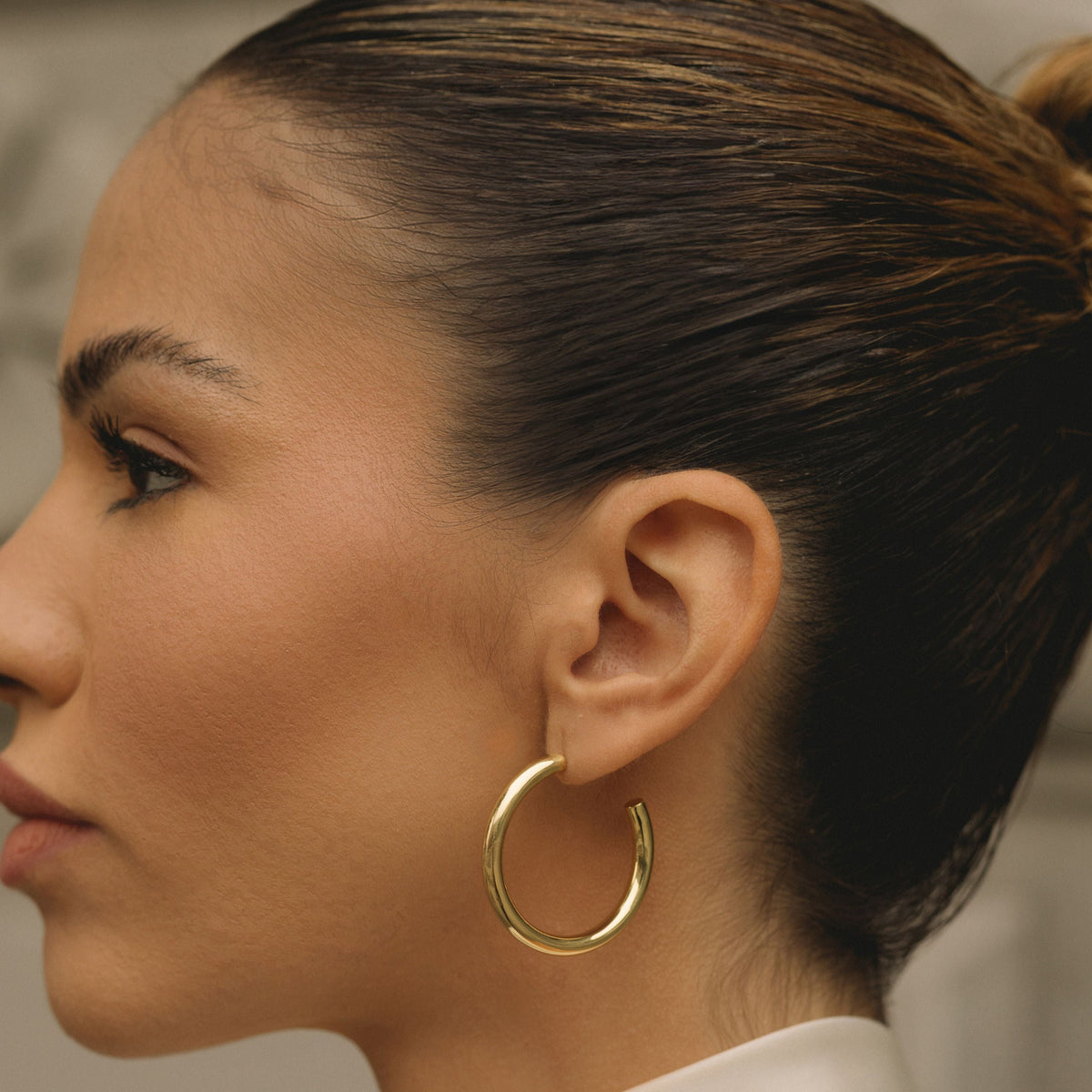 Gold-filled 30mm hoop earrings, large smooth hoops shown in side profile