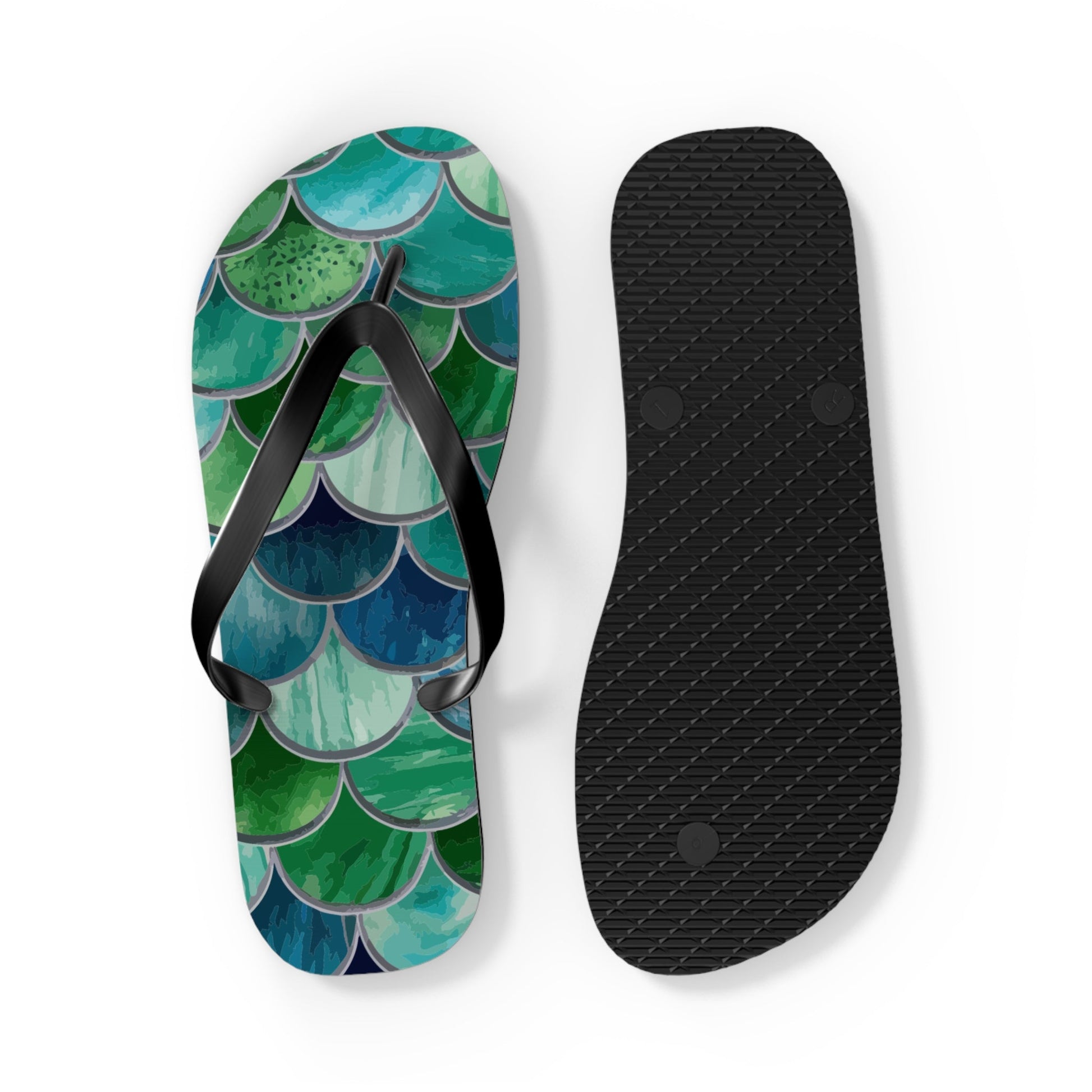 Mermaid-scale flip-flops, one showing patterned top and the other showing black textured outsole