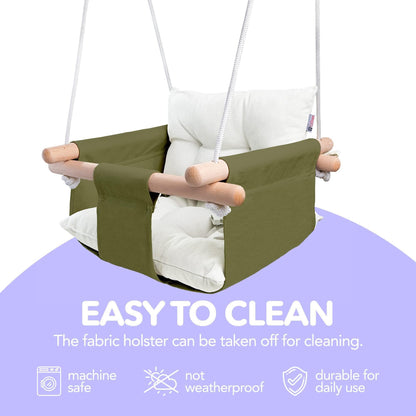 Olive canvas hanging baby swing with white cushions and two wooden side dowels