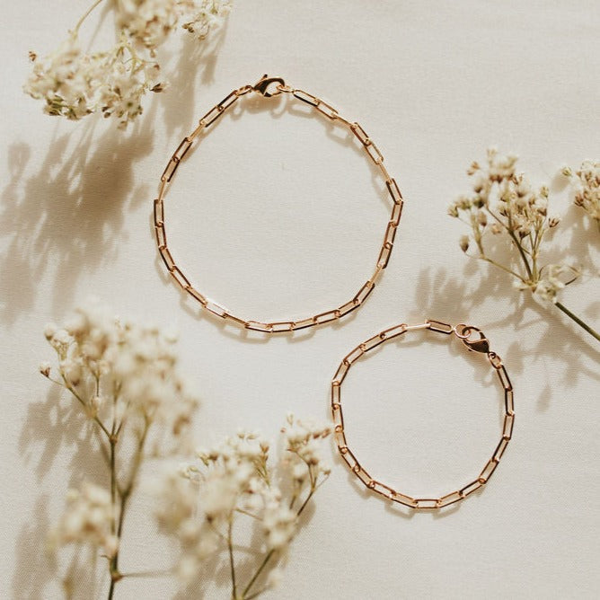 Gold-filled paperclip bracelet with elongated links and lobster clasp, shown in two sizes.