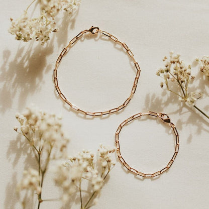 Gold-filled paperclip bracelet with elongated links and lobster clasp, shown in two sizes.