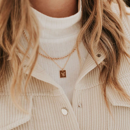 Gold-filled rope necklace worn as a short, delicate chain.