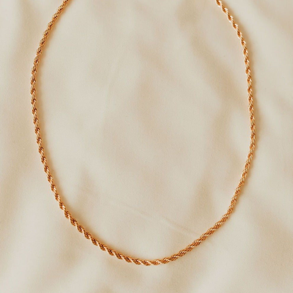 Gold-filled rope necklace arranged in a simple loop.
