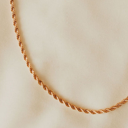 Gold-filled rope necklace with a close view of its twisted chain.
