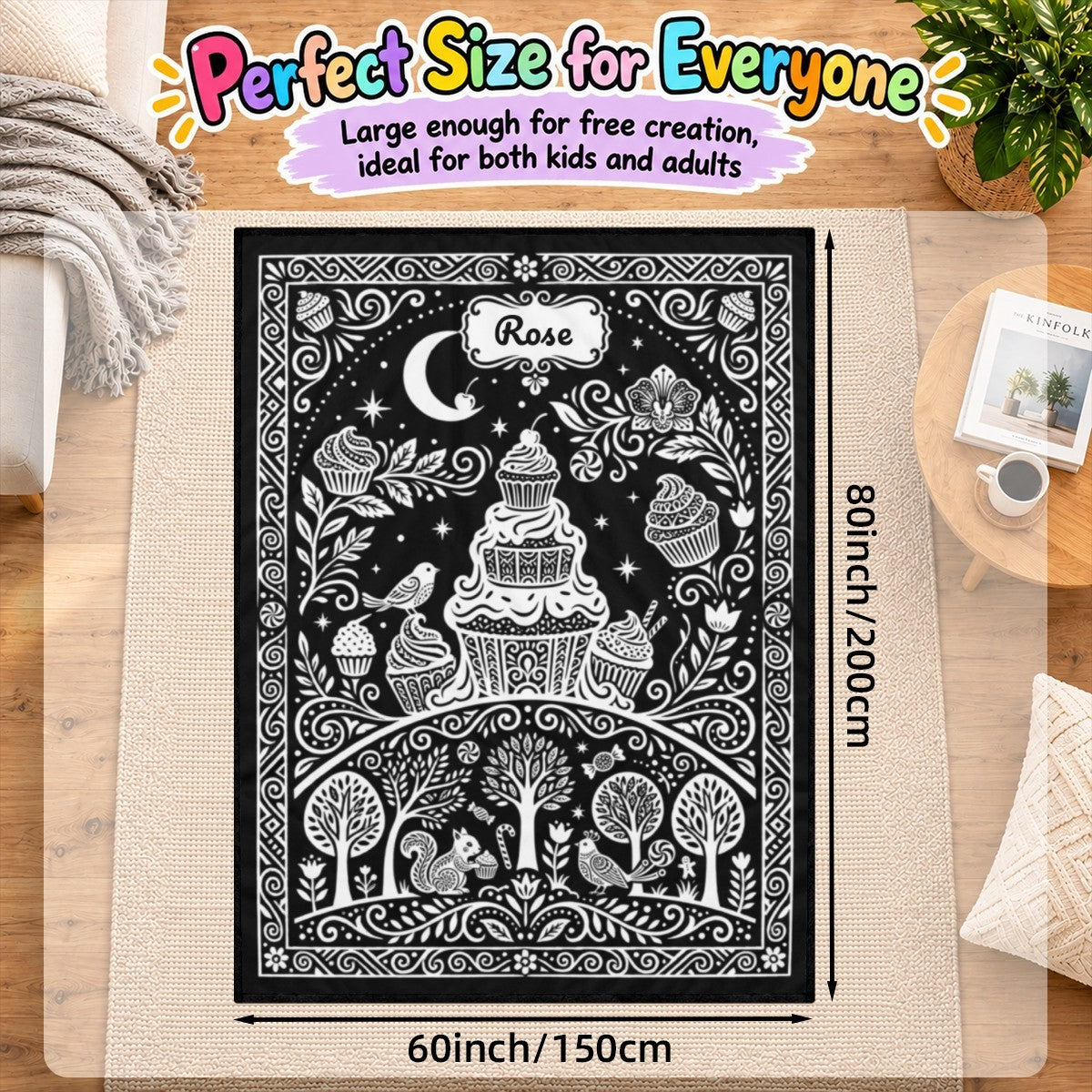 Coloring blanket with black background and white cupcake, birds, and garden doodle art