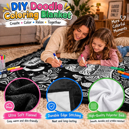 Mother and child coloring a black-and-white doodle blanket with fabric markers