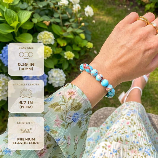 Aqua terra jasper bead bracelet on wrist, stretchy blue and brown speckled beads