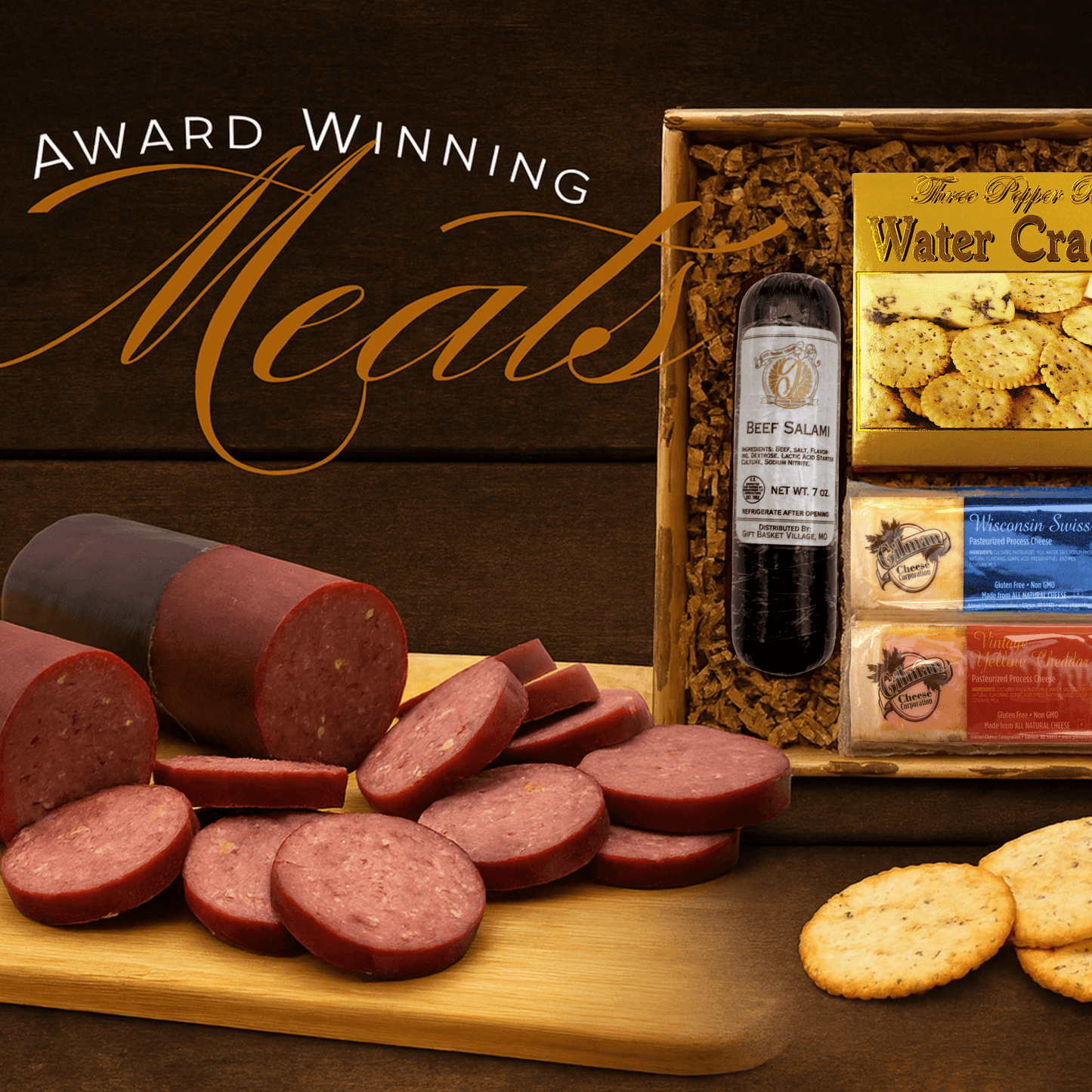 Beef salami and sausage slices with water crackers beside a gift basket