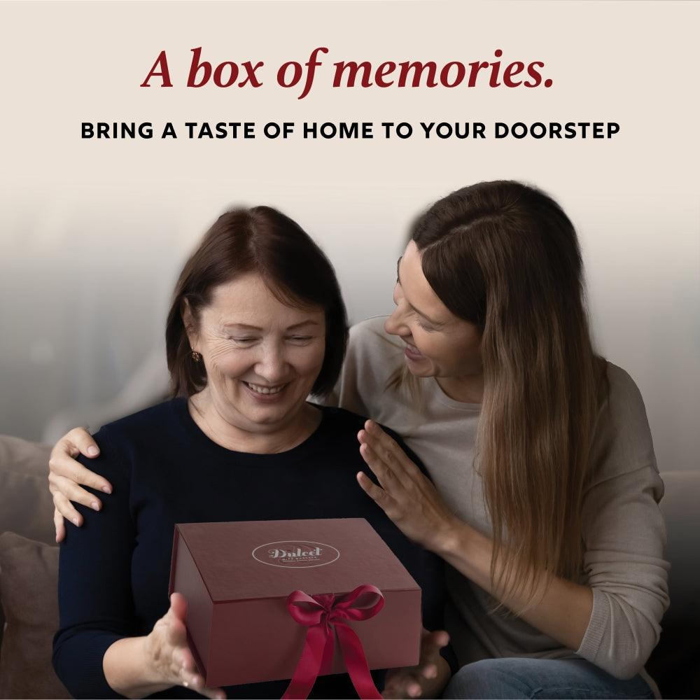 Dulcet Valentine gift box with ribbon, held by two people for delivery