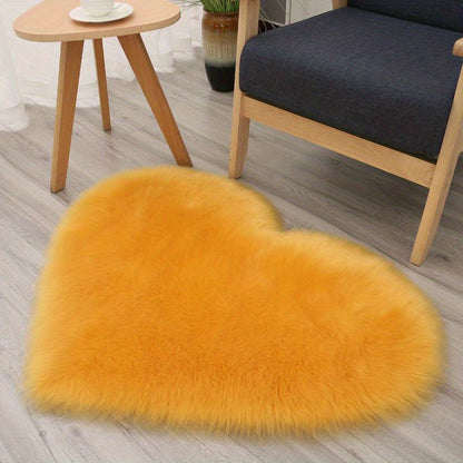 Yellow heart-shaped faux fur rug with soft shaggy plush pile