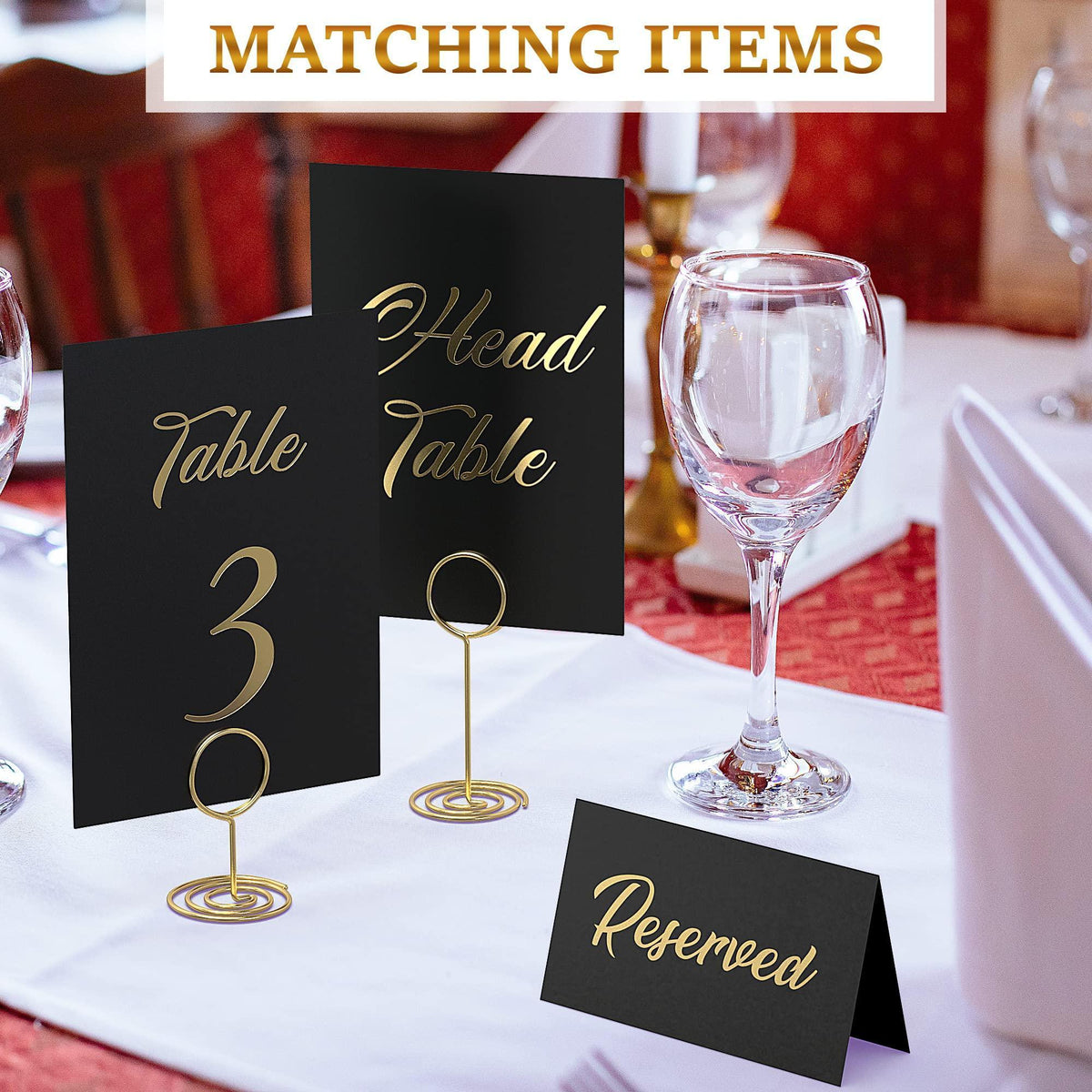 Black cards with gold foil “Head Table” and “Table 3,” plus “Reserved” card