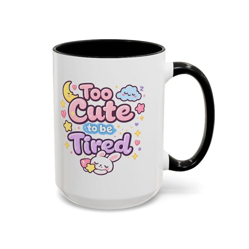White mug with black rim and handle, kawaii bunny “Too Cute to be Tired” design with hearts.