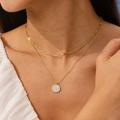 Layered gold necklace with pave disc pendant