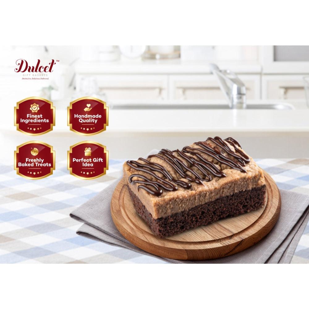 Chocolate crumb cake slice with drizzled topping on a wooden serving board