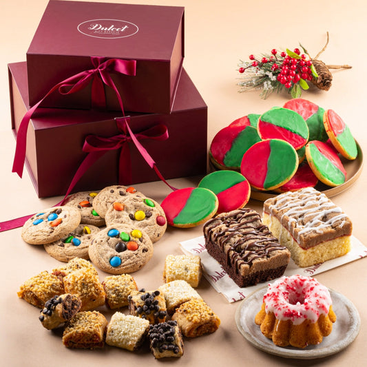 Christmas sampler gift tower with open box of assorted cookies, brownies, and pastries