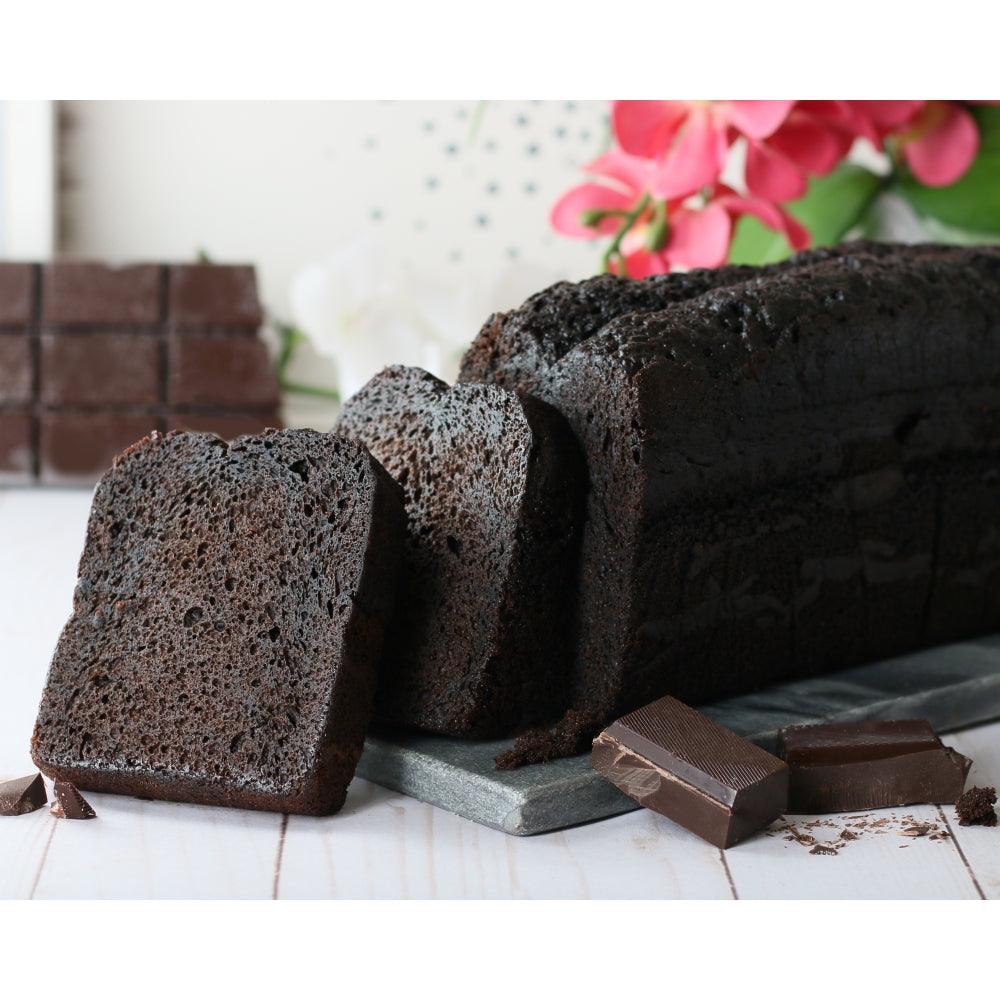 Dark sliced pound cake, brownie pieces, and cookies in a gift tin