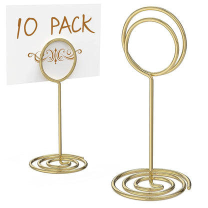 Set of two gold oval table number holders with spiral bases and card frames