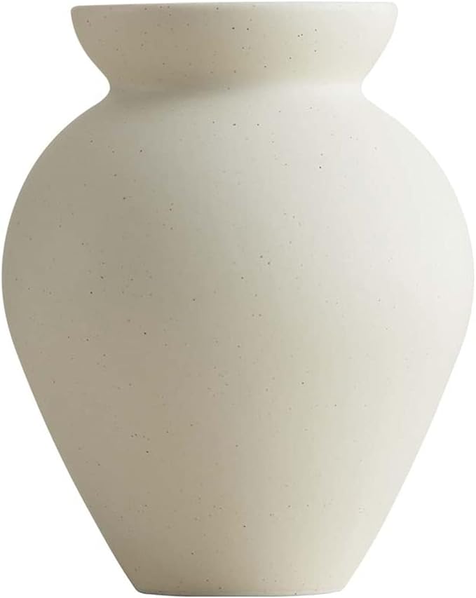 Cream ceramic milk can vase with matte speckled finish, tapered body and flared top.