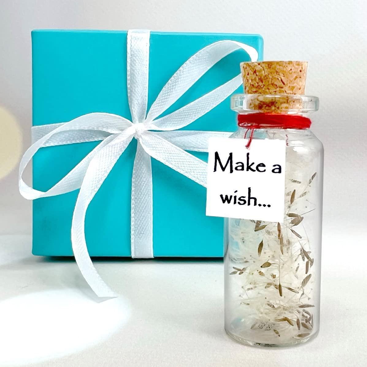 Turquoise gift box with white ribbon bow and miniature wish bottle jar label