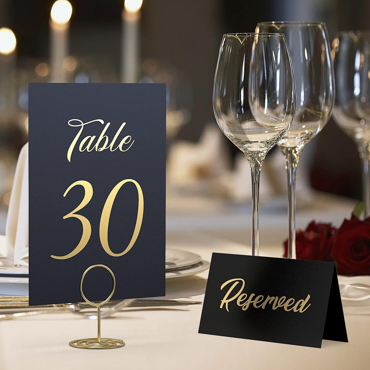Black “Table 30” card with gold foil on a stand and a separate “Reserved” card