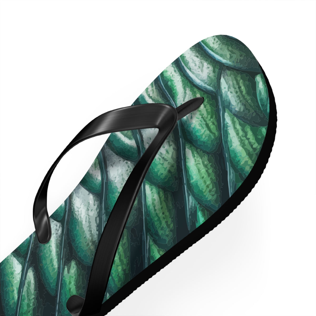 Angled view of green merman scales flip flop with black thong straps and thick sole