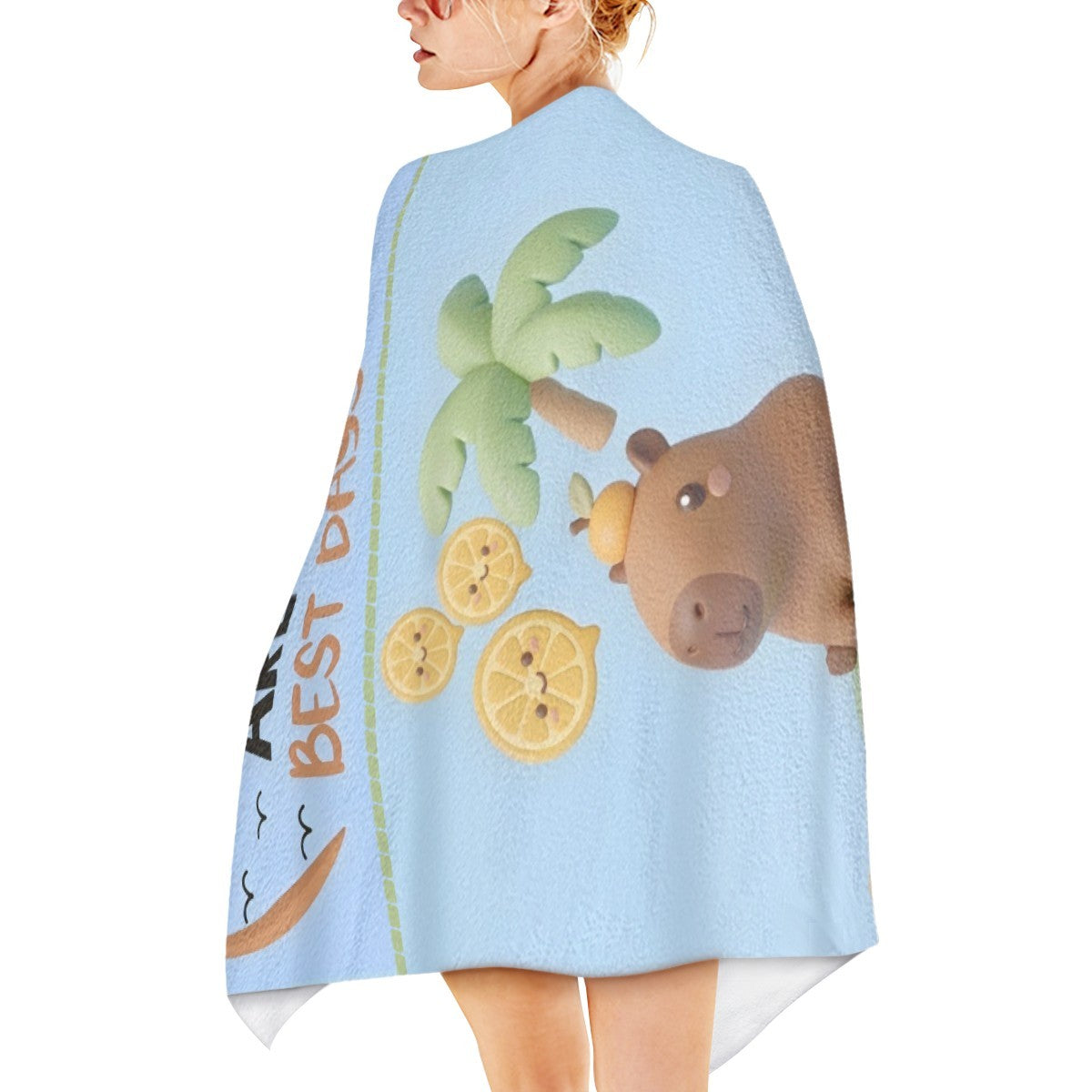 Light blue towel wrap detail with bear and palm graphic; white rounded corner trim.