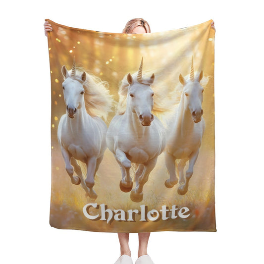 Unicorn name blanket with three white horses and gold sparkle, name Charlotte