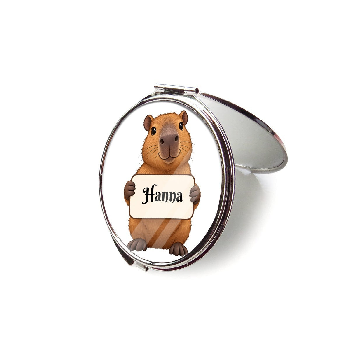 Open silver compact mirror showing capybara artwork on the lid