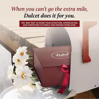 Sampler gift box with red ribbon and white candle