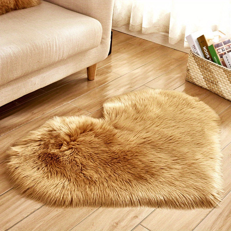 Tan heart-shaped faux fur rug with thick shaggy plush pile