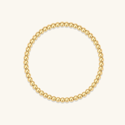 Gold bead elastic bracelet with small round beads, simple loop design