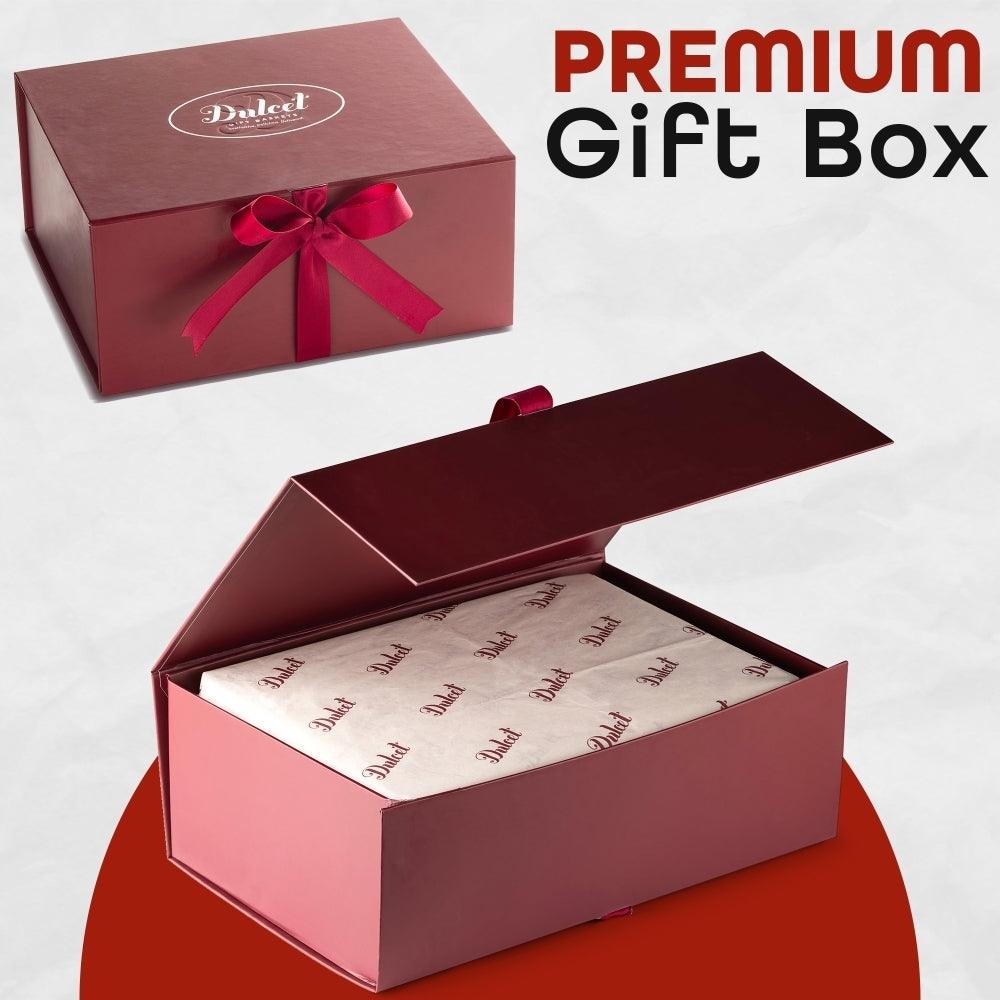 Premium Geschenkbox mit roter Schleife, geöffnet mit Papierfüllung