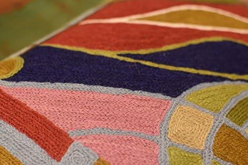 Lumbar pillow cover fabric detail with red, navy, pink, and tan abstract shapes