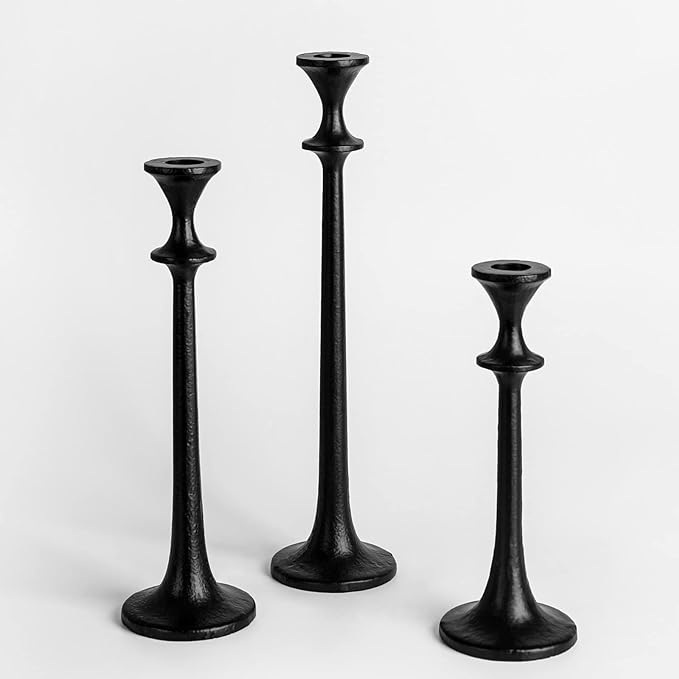 Set of 3 black iron taper candle holders with staggered heights and flared tops