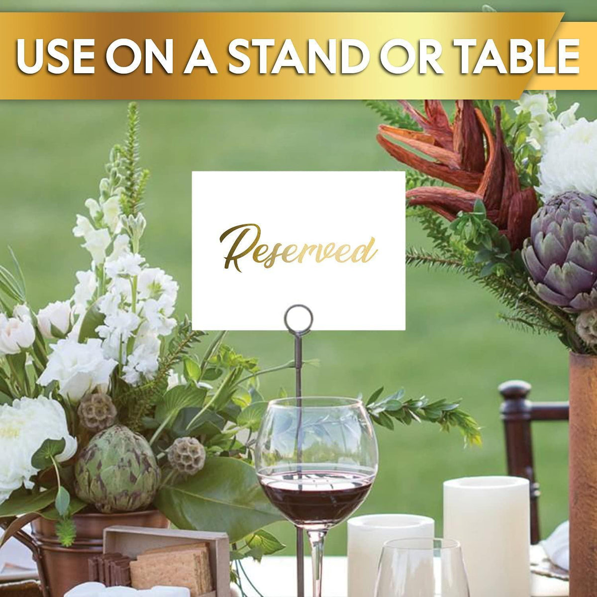 Reserved table tent sign on a stand with gold “Reserved” script on white paper
