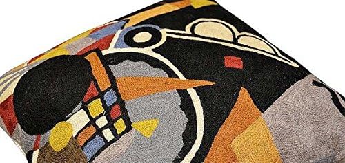 Black abstract pillow cover corner detail with colorful geometric embroidery