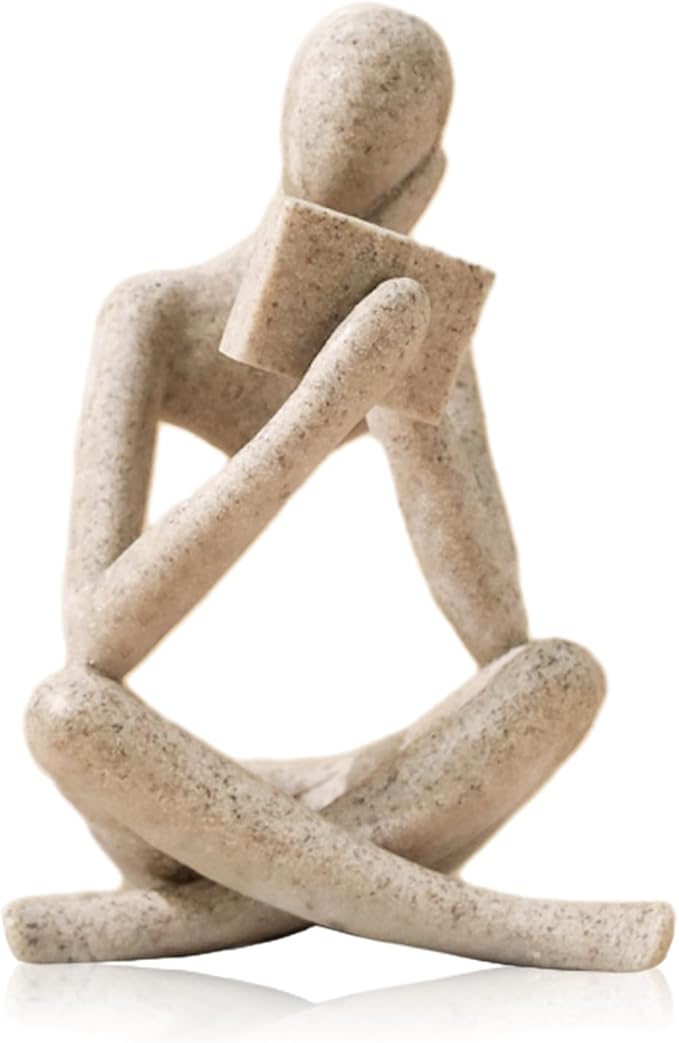 Beige abstract resin thinker bookend statue, seated with one knee raised, reading pose