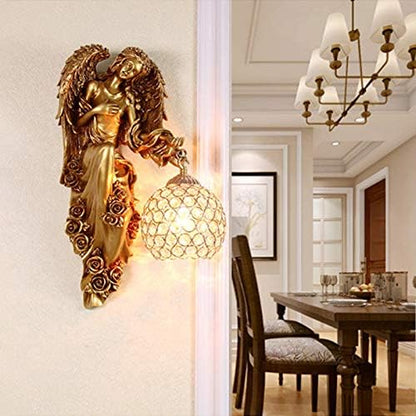 Gold angel wall lamp with clear crystal globe shade on wall