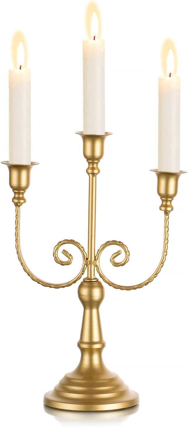 Gold metal three-candle taper holder with curved vine arms and pedestal base