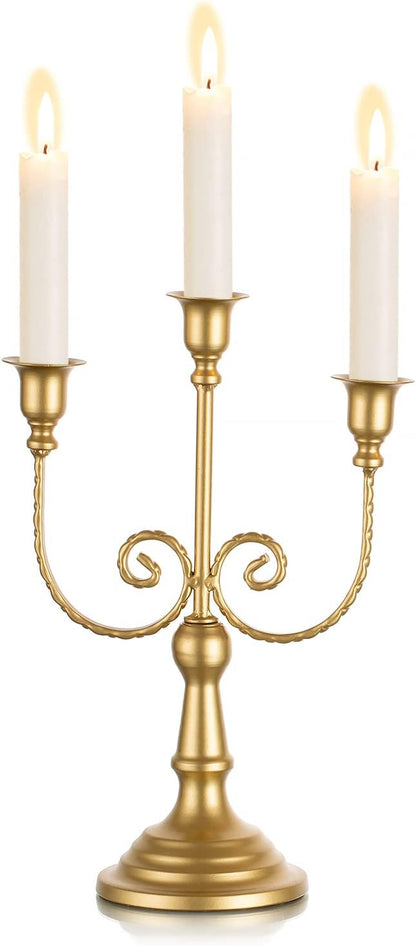 Gold metal three-candle taper holder with curved vine arms and pedestal base