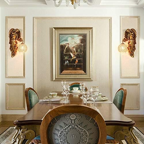 Pair of gold angel wall sconces with clear crystal globe shades