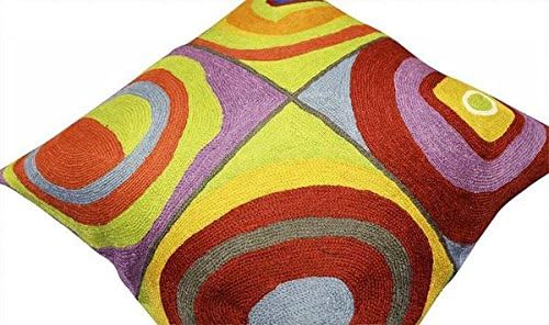 Abstract geometric pillow cover with multicolor concentric arcs on a diagonal view
