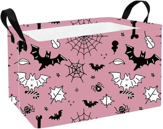 Rectangular pink fabric storage basket with Halloween bat and spiderweb print, foldable handles