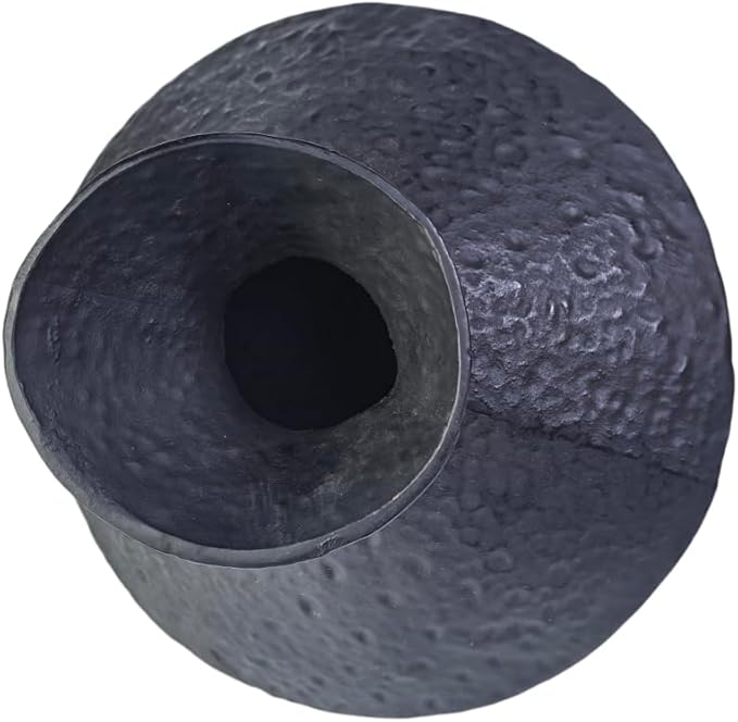 Close-up of dark hammered cast iron vase opening with rounded rim