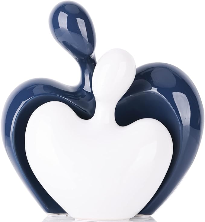 Blue and white ceramic abstract hugging couple figurines, heart-shaped design with glossy finish.