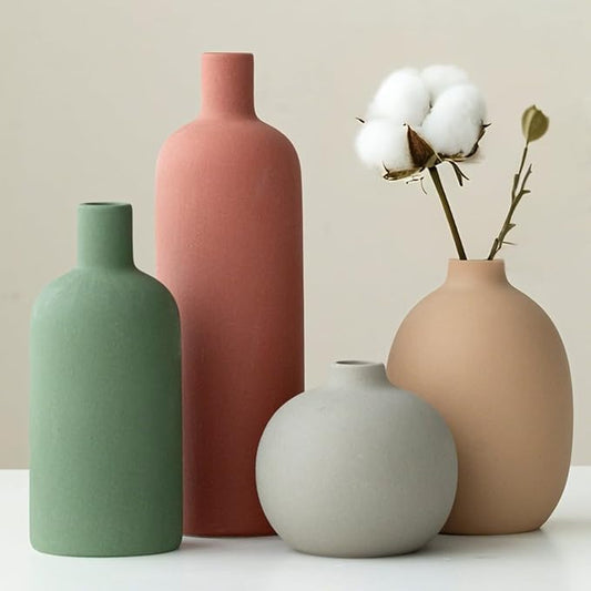 Set of 4 matte ceramic vases in green, terracotta pink, peach, and off-white