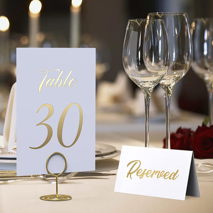 Gold foil table number card “Table 30” with a “Reserved” place card